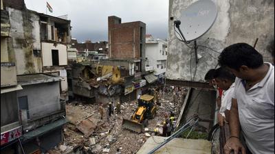 Rescue operations underway at Old Sabzi Mandi area, on Monday (Sanjeev Verma/HT)