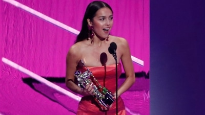 Olivia Rodrigo won the Best New Artist award at the 2021 MTV VMAs. She chose an archival look from Versace for her big day, The strapless flounce gown in different shades of pink featured draped details.&nbsp; (REUTERS)
