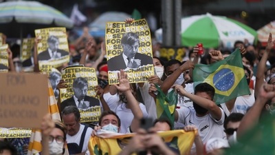 People attend a protest to demand the impeachment of Brazil's President Jair Bolsonaro and against his handling of the coronavirus disease (Covid-19) pandemic, at Paulista Avenue in Sao Paulo. (REUTERS)