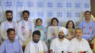 Congress workers joining the AAP in the presence of senior party leaders in Chandigarh on Monday. (Keshav Singh/HT)