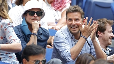 Brad Pitt and Bradley Cooper at the US open. (AFP) Brad Pitt and Bradley Cooper at the US open. (AFP)