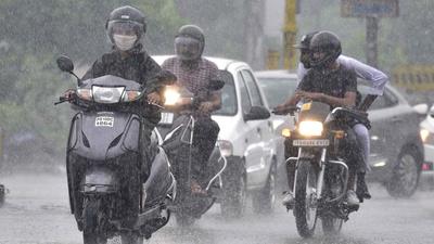 Commuters make their way through a rainfall at Bharat Nagar Chowk, in Ludhiana on September 11. (HT photo) Commuters make their way through a rainfall at Bharat Nagar Chowk, in Ludhiana on September 11. (HT photo)