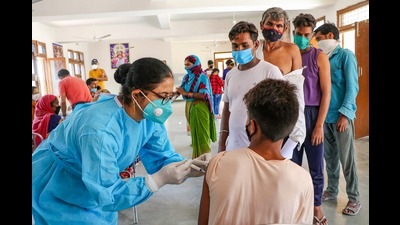 A labourer receiving a dose of Covid-19 vaccine in the outskirts of Jammu on Monday. (PTI)