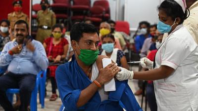 A health worker inoculates a man with a dose of Covid vaccine at a camp in Chennai on September 12. (AFP)