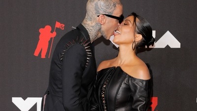 Travis Barker and Kourtney Kardashian pack on the PDA at the red carpet. (REUTERS)