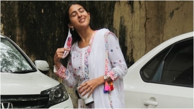 Sara Ali Khan's floaty, feminine suit set featured a breezy white kurta that came covered in pink, blue, green and purple polka-dot print. The top had a round neckline and intricate embroidery on the torso, cuffs and hemline. (HT Photo/Varinder Chawla)