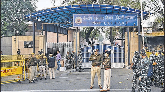 New Delhi, India - March 20, 2020: Police personnel seen as people gather to celebrate after four convicts in the December 2012 gang rape case were hanged at 5:30am in Tihar jail, at Tihar Village in New Delhi, India, on Friday, March 20, 2020. (Photo by Biplov Bhuyan/ HT Archive) (Biplov Bhuyan/HT Archive)