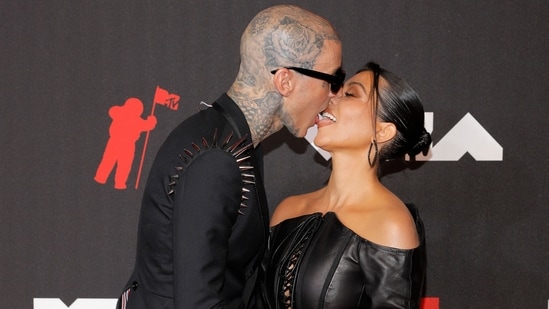 Travis Barker and Kourtney Kardashian made their red carpet debut as a couple at the MTV Video Music Awards.  The two were twins in black outfits and seemed to be very much in love.  Kourtney wore a leather corset style mini dress.  (REUTERS)