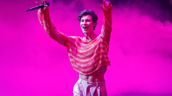 Shawn Mendes captured during his performance at the MTV Video Music Awards. For his red carpet appearance, he wore a long white blazer and white pants from Mans, and teamed it with a white tank top by Judy Turner.&nbsp;(REUTERS)