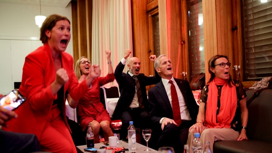 Norway's Labor leader Jonas Gahr Store (2nd R) cheers after seeing the exit poll results of the Labor Party's election event in Folkets Hus, in Oslo, during the 2021 Norwegian parliamentary elections. (AFP) Norway's Labor leader Jonas Gahr Store (2nd R) cheers after seeing the exit poll results of the Labor Party's election event in Folkets Hus, in Oslo, during the 2021 Norwegian parliamentary elections. (AFP)