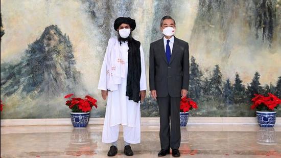 Chinese State Councilor and Foreign Minister Wang Yi meets with Mullah Abdul Ghani Baradar, political chief of Afghanistan's Taliban, in Tianjin, China, on July 28, 2021. China’s enhanced diplomatic efforts primarily focus on securing Xinjiang against any jihadist influence, and Beijing does not seem to have any intention to involve itself in the treacherous territory of Afghanistan based on miscalculations of power and interests. (VIA REUTERS) Chinese State Councilor and Foreign Minister Wang Yi meets with Mullah Abdul Ghani Baradar, political chief of Afghanistan's Taliban, in Tianjin, China, on July 28, 2021. China’s enhanced diplomatic efforts primarily focus on securing Xinjiang against any jihadist influence, and Beijing does not seem to have any intention to involve itself in the treacherous territory of Afghanistan based on miscalculations of power and interests. (VIA REUTERS)