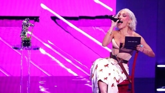 Host Doja Cat presents the award for best new artist at the MTV Video Music Awards.(Charles Sykes/Invision/AP)