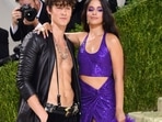 Camila Cabello wore a purple sparkly crop top and skirt, while Shawn Mendes opted for an open leather jacket and black pants. (AFP)