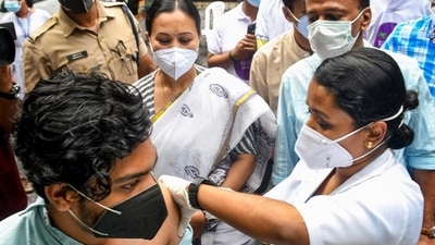 A medic administers a dose of the Covid-19 vaccine to a beneficiary in Thiruvananthapuram. (PTI Photo)
