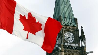The Canadian flag flies on Parliament Hill in Ottawa. Two Indo-Canadian academics have claimed that the Canadian government is adopting double standards on Covid-19 testing for those stuck in India. (REUTERS) The Canadian flag flies on Parliament Hill in Ottawa. Two Indo-Canadian academics have claimed that the Canadian government is adopting double standards on Covid-19 testing for those stuck in India. (REUTERS)