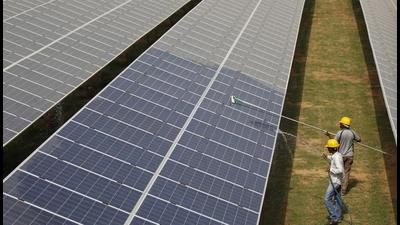 Workers clean photovoltaic panels inside a solar power plant in Gujarat, India. US senator Bob Menendez has introduced a legislation for cooperation between the United States and India related to clean climate technologies and energy transmission. (REUTERS) Workers clean photovoltaic panels inside a solar power plant in Gujarat, India. US senator Bob Menendez has introduced a legislation for cooperation between the United States and India related to clean climate technologies and energy transmission. (REUTERS)