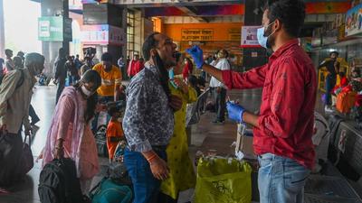 Passengers being tested for Covid at a Delhi railway station. The Delhi high court has issued notices to Delhi and Haryana police over a petition which alleged that a private firm was collecting samples for Covid tests such as RT-PCR without licence. (AFP) Passengers being tested for Covid at a Delhi railway station. The Delhi high court has issued notices to Delhi and Haryana police over a petition which alleged that a private firm was collecting samples for Covid tests such as RT-PCR without licence. (AFP)