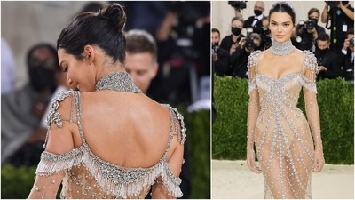 Kendall Jenner arrived at the Met Gala 2021 in a sheer gown adorned with glittering gemstones. (AFP)