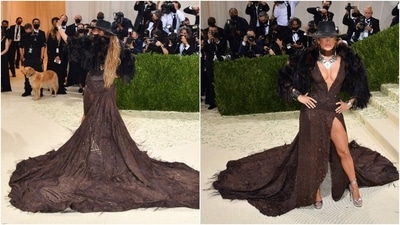 Ralph Lauren dressed Jennifer Lopez in fur with a brown look in her signature plunge at the neck and high slit, a wide-brimmed Western-style hat on her head. (AFP)