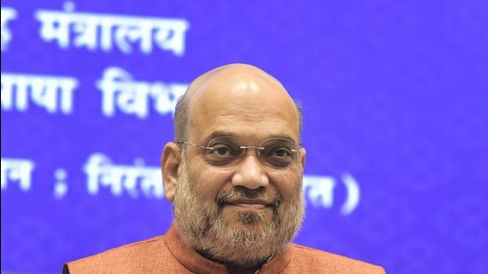 Union Home Minister Amit Shah releases book during the Hindi Divas Samaroh 2021 at Vigyan Bhawan in New Delhi, Tuesday. (PTI)