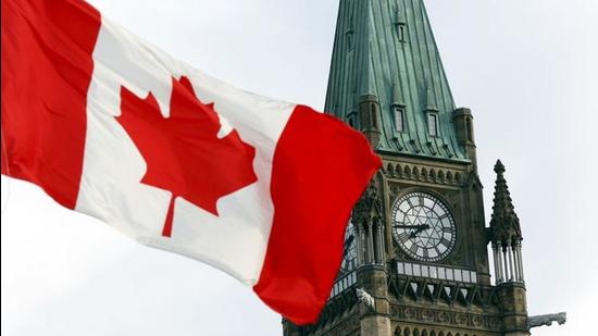 The Canadian flag flies on Parliament Hill in Ottawa. Two Indo-Canadian academics have claimed that the Canadian government is adopting double standards on Covid-19 testing for those stuck in India. (REUTERS)