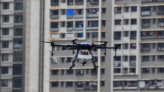 BMC workers fumigate Dhobi Ghat using a drone as part of the precautionary measures to prevent the spread of dengue and malaria during monsoon. (HT PHOTO) BMC workers fumigate Dhobi Ghat using a drone as part of the precautionary measures to prevent the spread of dengue and malaria during monsoon. (HT PHOTO)