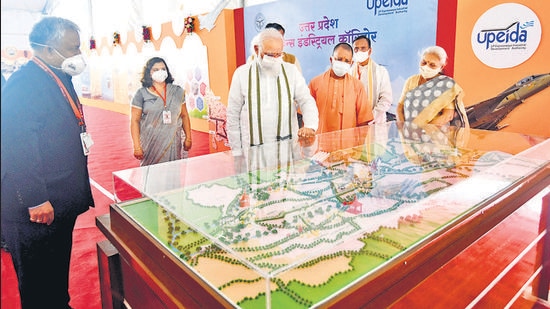 Prime Minister Narendra Modi and chief minister Yogi Adityanath take a look at exhibition models of the Aligarh node of Uttar Pradesh Defence Industrial Corridor and Raja Mahendra Pratap Singh State University, in Aligarh on Tuesday. (Mukesh Upadhyay/HT photo) Prime Minister Narendra Modi and chief minister Yogi Adityanath take a look at exhibition models of the Aligarh node of Uttar Pradesh Defence Industrial Corridor and Raja Mahendra Pratap Singh State University, in Aligarh on Tuesday. (Mukesh Upadhyay/HT photo)