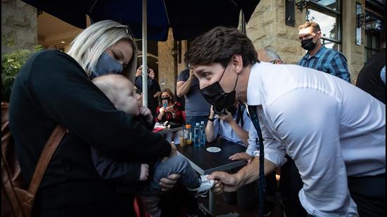 Justin Trudeau, Canada’s prime minister, greets a baby while campaigning in Port Coquitlam, British Columbia. Justin Trudeau faces a tough fight to eke out even a narrow victory in the snap elections he called hoping to strengthen his grip on power in Canada. (Bloomberg) Justin Trudeau, Canada’s prime minister, greets a baby while campaigning in Port Coquitlam, British Columbia. Justin Trudeau faces a tough fight to eke out even a narrow victory in the snap elections he called hoping to strengthen his grip on power in Canada. (Bloomberg)