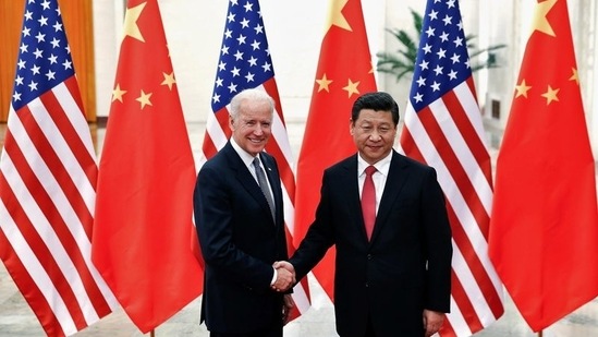 Chinese President Xi Jinping shakes hands with US President Joe Biden (L) inside the Great Hall of the People in Beijing, in this file photo from 2013(REUTERS)