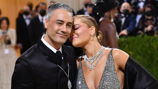 English singer-songwriter Rita Ora and New Zealand director-actor Taika Waititi shared an adorable moment at the Met Gala 2021. Reports suggested that the two even confirmed their engagement, as Rita was seen wearing a ring on her engagement finger. As for her clothes, she chose a sparkly two-piece by Prada with a black silk drape and complementing diamond jewellery.(AFP)