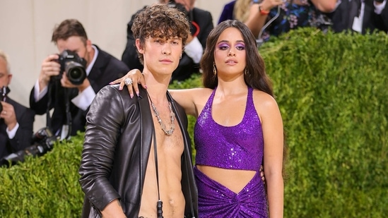 Shawn Mendes and Camila Cabello attended the 2021 Met Gala looking like the most fashionable couple ever. The two were spotted laughing at a secret joke and smiling adorably at each other on the red carpet. While Shawn arrived fashionably dressed in an open leather jacket and black pants, Camila chose a purple sparkly crop top and skirt.(AFP)