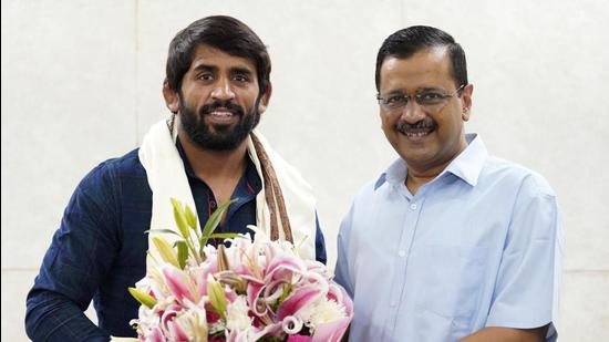 Delhi chief minister Arvind Kejriwal felicitates Tokyo Olympics Bronze medalist wrestler Bajrang Punia on Tuesday. (ANI) Delhi chief minister Arvind Kejriwal felicitates Tokyo Olympics Bronze medalist wrestler Bajrang Punia on Tuesday. (ANI)