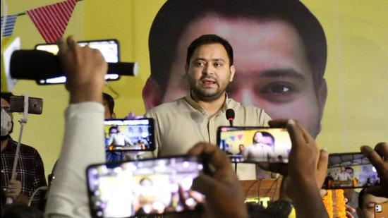 RJD leader Tejashwi Yadav addresses Milan Samaroh at party office in Patna on Tuesday. (Santosh Kumar/HT Photo) RJD leader Tejashwi Yadav addresses Milan Samaroh at party office in Patna on Tuesday. (Santosh Kumar/HT Photo)