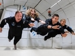 The Inspiration4 crew float in zero gravity while training for the mission.(AFP Photo) The Inspiration4 crew float in zero gravity while training for the mission.(AFP Photo)