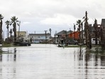Streets are flooded from Hurricane Nicholas on Tuesday in Surfside Beach, Texas. (Jon Shepley/Houston Chronicle via AP) Streets are flooded from Hurricane Nicholas on Tuesday in Surfside Beach, Texas. (Jon Shepley/Houston Chronicle via AP)