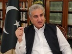 Pakistan's Foreign Minister Shah Mehmood Qureshi gestures as he speaks during an interview.