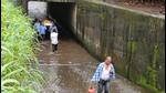 Residents carry a dead body amid water logged at the railway underpass in Badlapur. Residents carry a dead body amid water logged at the railway underpass in Badlapur.
