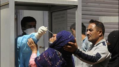 A health worker collects a sample for Covid testing from a woman in Srinagar on Wednesday. (Waseem Andrabi/HT) A health worker collects a sample for Covid testing from a woman in Srinagar on Wednesday. (Waseem Andrabi/HT)
