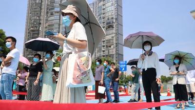 People line up to get nucleic acid tests at a testing site, following new cases of Covid-19, in Xiamen, Fujian province, China. (REUTERS)