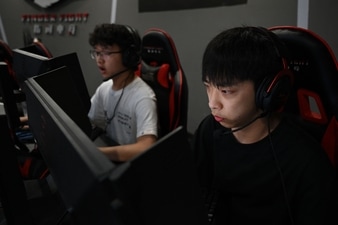 Youths play computer games at an internet cafe in Beijing (AFP) Youths play computer games at an internet cafe in Beijing (AFP)