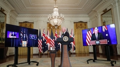 Biden, British Prime Minister Boris Johnson and Australian Prime Minister Scott Morrison appeared together virtually to detail the new alliance, which will be called AUKUS (Reuters) Biden, British Prime Minister Boris Johnson and Australian Prime Minister Scott Morrison appeared together virtually to detail the new alliance, which will be called AUKUS (Reuters)