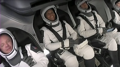 This screengrab taken from the SpaceX live webcast shows crew members (from R) Hayley Arceneaux, Jared Isaacman, Sian Proctor, and Christopher Sembroski after being buckled into their seats in the Crew Dragon capsule ahead of the launch of the Inspiration4 at NASA's Kennedy Space Center in Florida, on September 15, 2021. (AFP) This screengrab taken from the SpaceX live webcast shows crew members (from R) Hayley Arceneaux, Jared Isaacman, Sian Proctor, and Christopher Sembroski after being buckled into their seats in the Crew Dragon capsule ahead of the launch of the Inspiration4 at NASA's Kennedy Space Center in Florida, on September 15, 2021. (AFP)