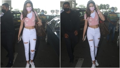 Ananya was spotted at the Mumbai airport today wearing the prettiest crop top, and you may want to take style notes from her. She wore a half-sleeve pink coloured top that featured ribbed details, button-up front and V neckline over a white crewneck crop top. (HT Photo/Varinder Chawla) Ananya was spotted at the Mumbai airport today wearing the prettiest crop top, and you may want to take style notes from her. She wore a half-sleeve pink coloured top that featured ribbed details, button-up front and V neckline over a white crewneck crop top. (HT Photo/Varinder Chawla)