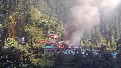 Smoke billowing from the houses on fire at Ramni village in Kinnaur district on Wednesday. (HT Photo) Smoke billowing from the houses on fire at Ramni village in Kinnaur district on Wednesday. (HT Photo)