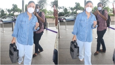 Kareena teamed her ensemble with white chunky lace-up sneakers, a face mask to keep herself safe during the pandemic, and stacked bracelets. She also carried an expensive Christian Dior oblique jacquard saddle tote bag with her jet-set outfit. (HT Photo/Varinder Chawla)