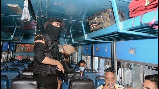 Punjab Police personnel conduct an inspection after the recovery of tiffin bombs in Amritsar, at a bus stand, in Jalandhar on August 10. (Sunny Sehgal) Punjab Police personnel conduct an inspection after the recovery of tiffin bombs in Amritsar, at a bus stand, in Jalandhar on August 10. (Sunny Sehgal)