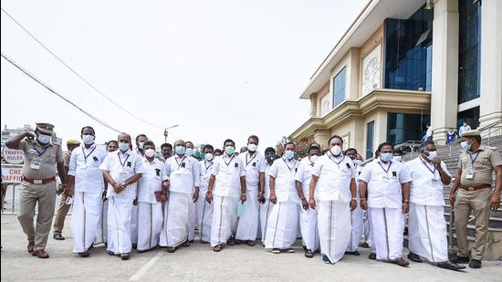 Leader of Opposition in the Tamil Nadu legislative assembly Edapaddi K. Palaniswami walks out with AIADMK MLAs sporting black badges over NEET suicides during the Budget Session at Kalaivanar Arangam in Chennai on September 13. (PTI)
