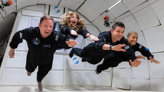 The Inspiration4 crew float in zero gravity while training for the mission.(AFP Photo)