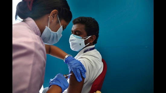 A health worker administers the Sputnik V coronavirus vaccine (AP)
