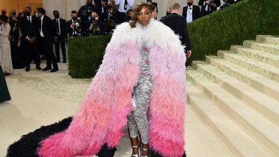 Serena Williams: Serena Williams looked majestic in a Gucci silver bodysuit with embellished stars. She topped it with a feather-laden cape with a long ombré train.(AFP)